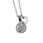 Silver necklace with a circle cherub pendant and a smaller heart charm on a chain