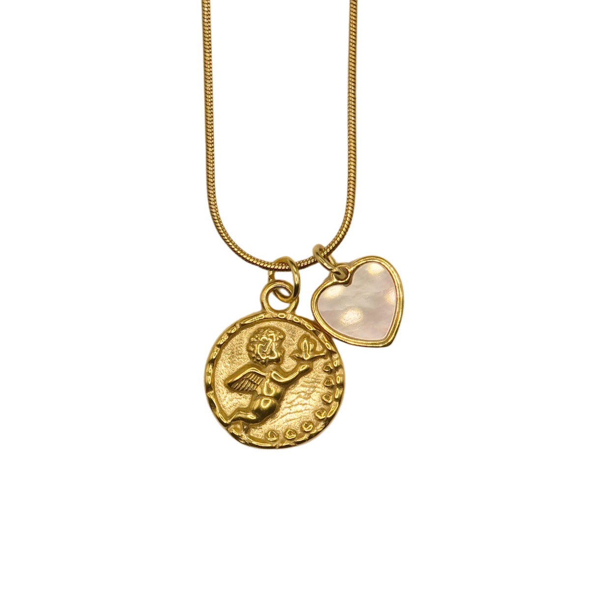 A gold-tone chain necklace with two charms: a textured, embossed round coin pendant with a cherub and a small heart-shaped charm with a smooth, milky-white inlay, shown against a plain white background.