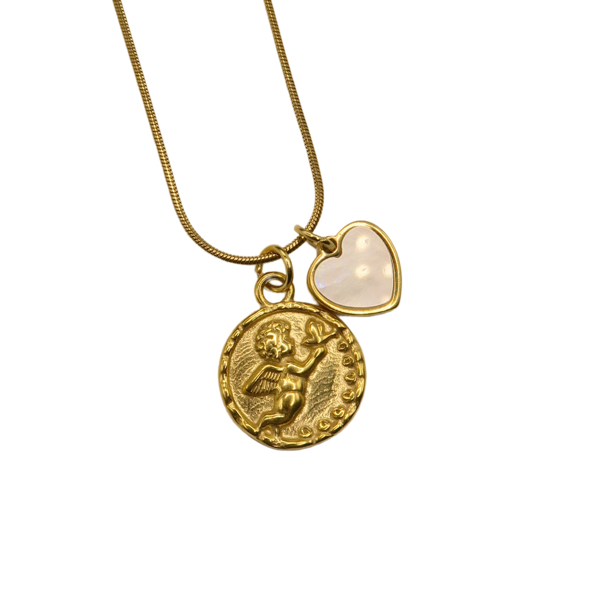 A gold-tone chain necklace with two charms: a textured, embossed round coin pendant with a cherub and a small heart-shaped charm with a smooth, milky-white inlay, laid against a plain white background.